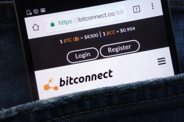 KONSKIE, POLAND - MAY 19, 2018: Bitconnect website displayed on smartphone hidden in jeans pocket clipart