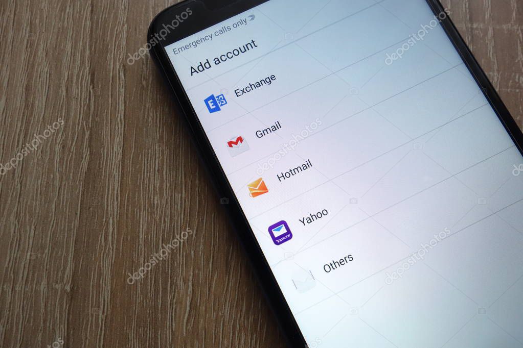 KONSKIE, POLAND - JUNE 17, 2018: Popular email service providers including Gmail, Yahoo, Hotmail, Exchange  displayed on a new modern smartphone