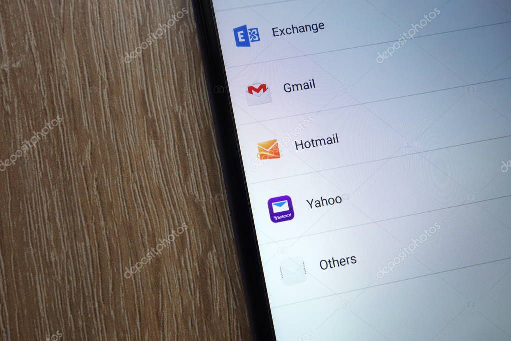 KONSKIE, POLAND - JUNE 17, 2018: Popular email service providers including Gmail, Yahoo, Hotmail, Exchange  displayed on a new modern smartphone