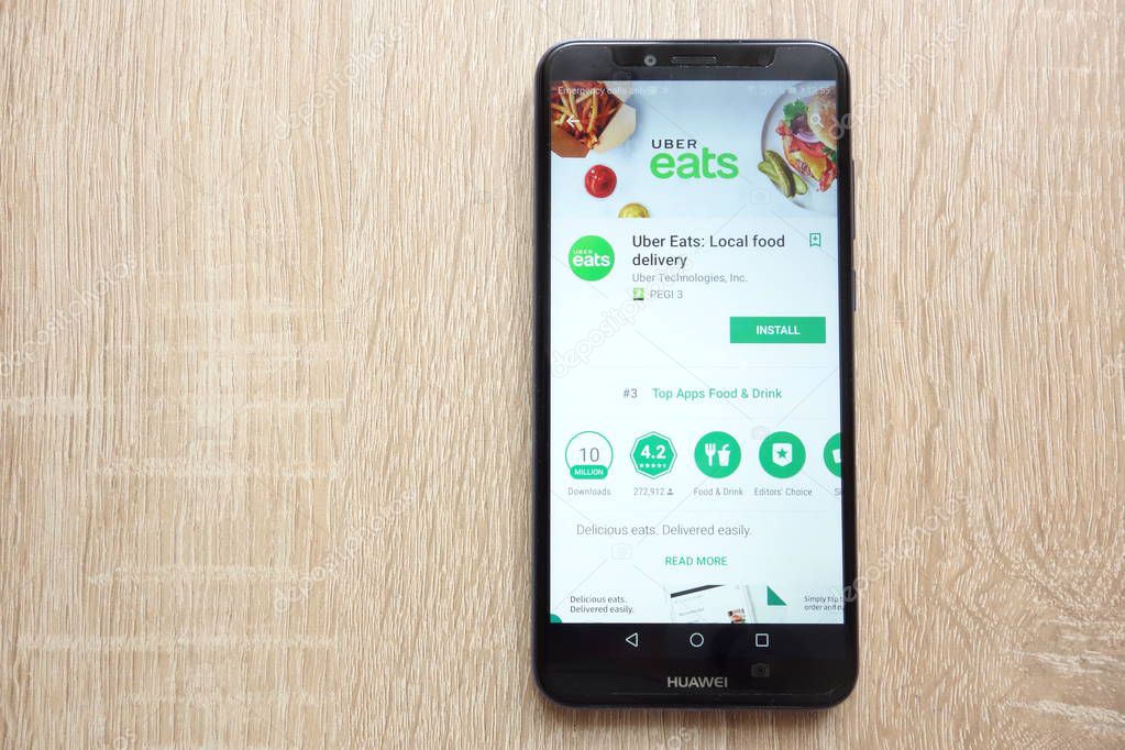KONSKIE, POLAND - JUNE 17, 2018: Uber Eats: Local food delivery app on Google Play Store website displayed on Huawei Y6 2018 smartphone