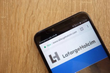 KONSKIE, POLAND - JULY 21, 2018: LafargeHolcim website displayed on a modern smartphone clipart