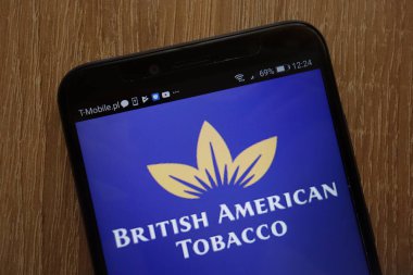 KONSKIE, POLAND - AUGUST 18, 2018: British American Tobacco logo displayed on a modern smartphone clipart