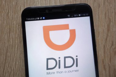 KONSKIE, POLAND - SEPTEMBER 06, 2018: DiDi logo displayed on a modern smartphone clipart