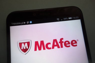 KONSKIE, POLAND - SEPTEMBER 15, 2018: McAfee logo on smartphone clipart