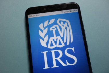 KONSKIE, POLAND - November 10, 2018: IRS (Internal Revenue Service) logo displayed on smartphone clipart