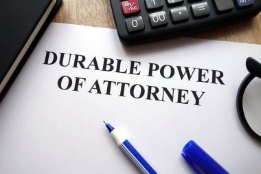 Durable power of attorney document, pen, glasses and calculator on desk clipart