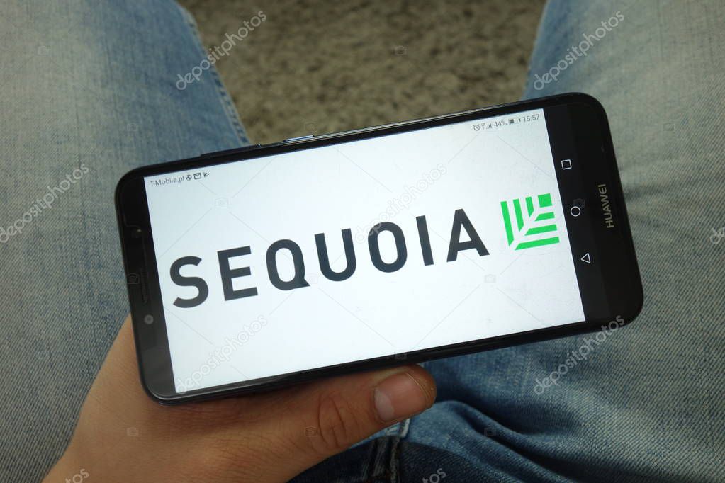 KONSKIE, POLAND - April 13, 2019: Man holding smartphone with Sequoia Capital firm logo