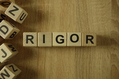 Rigor word from wooden blocks on desk clipart