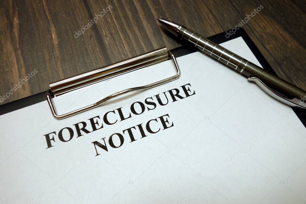 Clipboard with foreclosure notice mockup and pen on desk