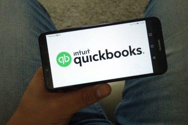 KONSKIE, POLAND - June 29, 2019: Intuit Quickbooks logo on mobile phone clipart