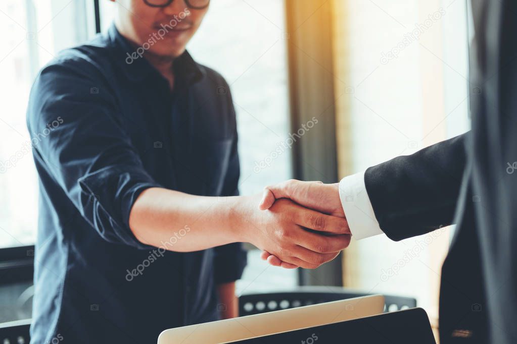 Business people colleagues shaking hands meting Planning Strategy Analysis Concept