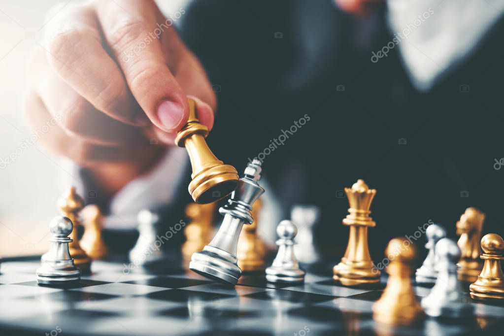 Businessman playing chess game Planning of leading strategy successful business leader concept