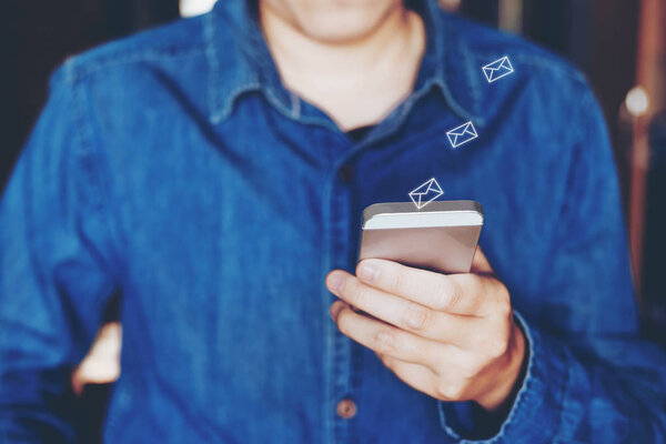 Businessman using mobile online icon social networking connection on screen