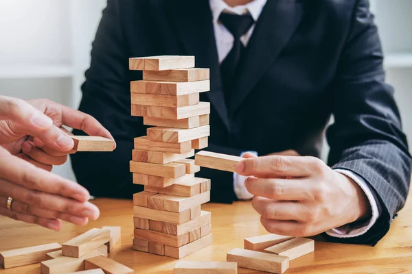 Businessman plan and strategy in business Domino Effect Problem