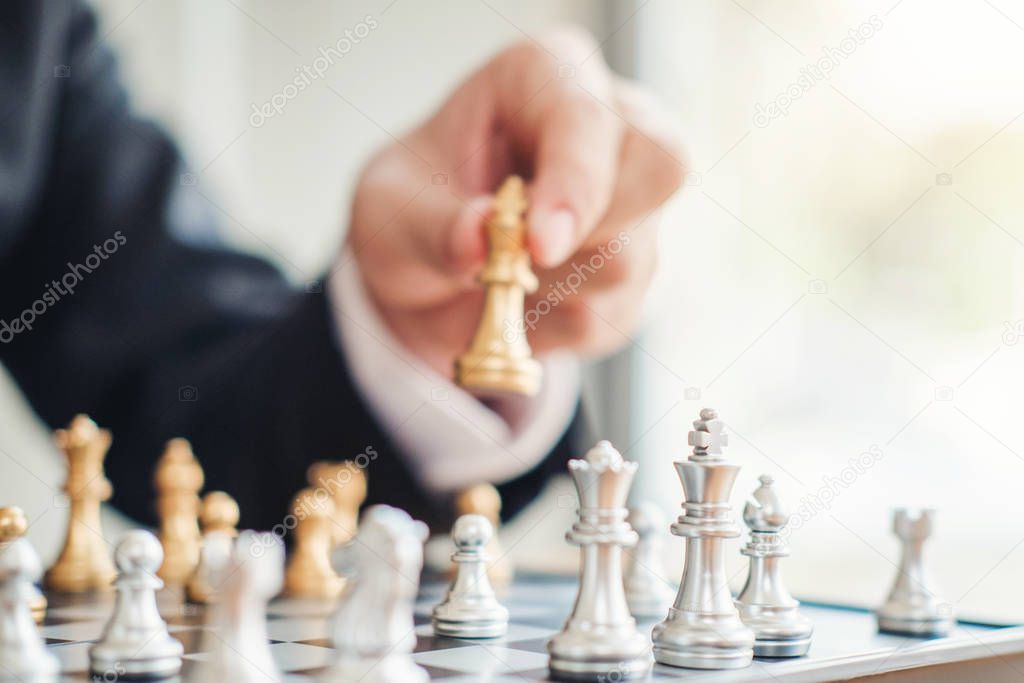 Businessman playing chess game Planning of leading strategy succ