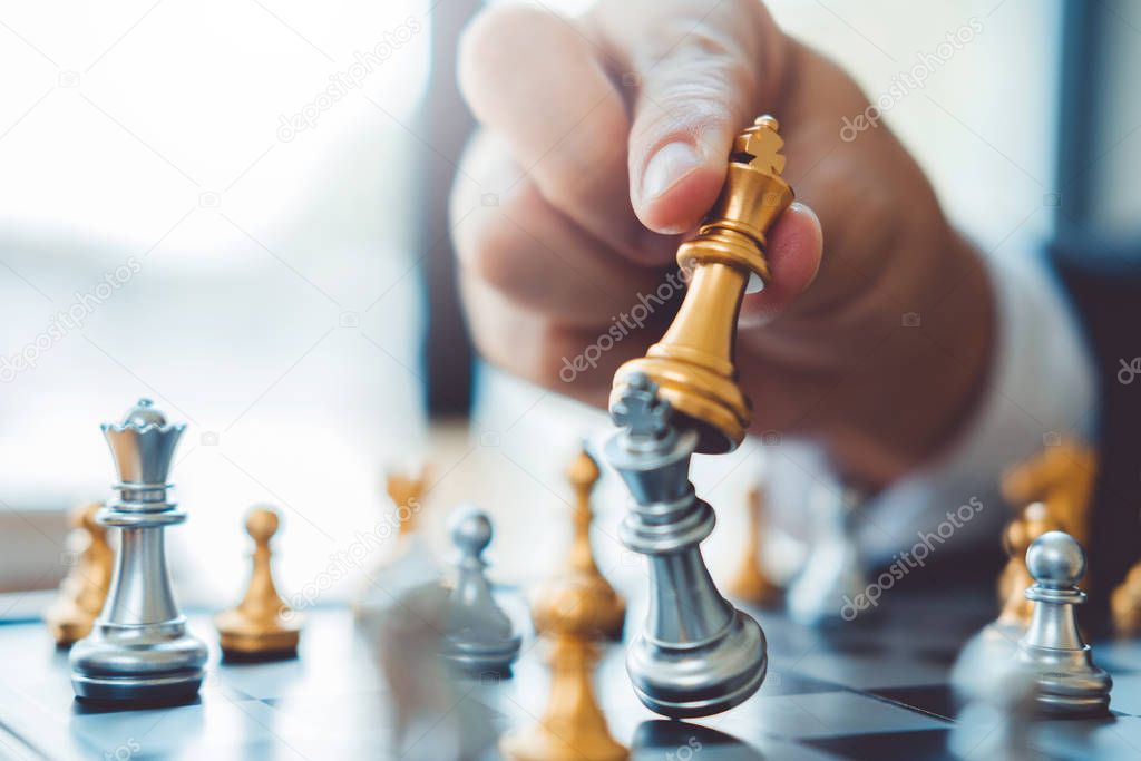 Businessman playing chess game Planning of leading strategy succ