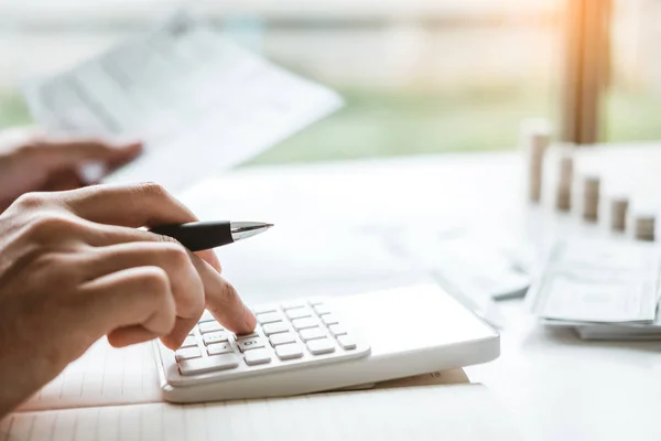 Man using calculator Accounting Calculating Cost Economic bills