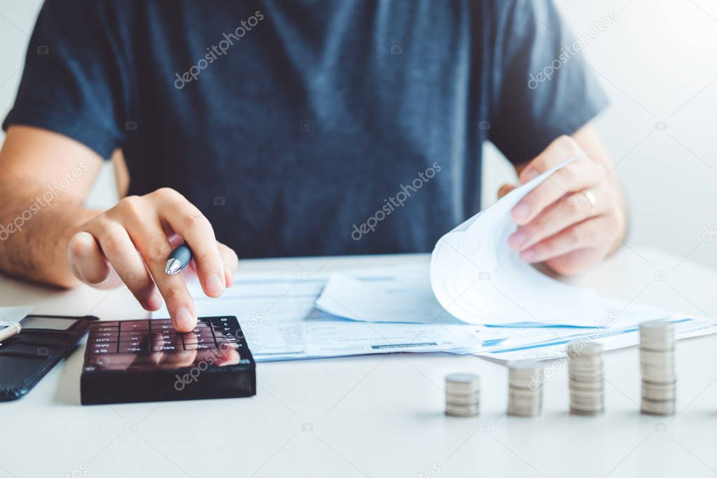 Man using calculator Accounting Calculating Cost Economic bills 