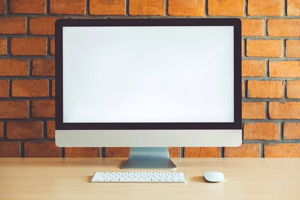 Workspace with Blank Computer Screen in cafe