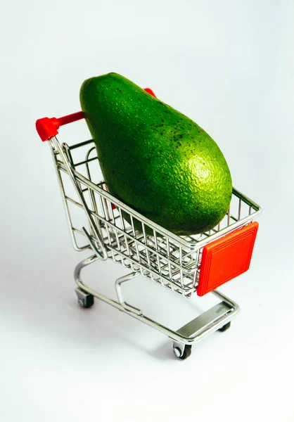 Shopping Trolley Fresh Green Avocado Fruit Consumption Concept Pushcart Wheels — Stock Photo, Image