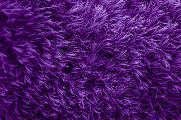 Purple fur texture. Violet glamorous background.