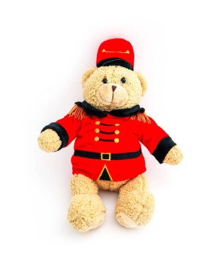 Teddy bear in a traditional British royal guardian Beefeater costume, isolated on white background.