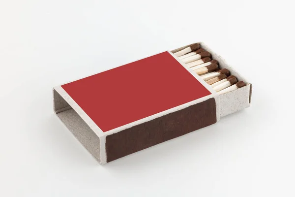 The open box of matches on white background. Side view. Blank space.