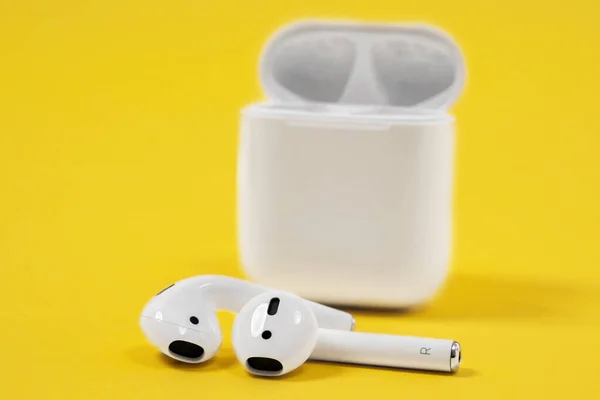 Rostov, Russia - July 06, 2020: Apple AirPods wireless Bluetooth headphones and charging case for Apple iPhone. New Apple Earpods Airpods in box. — Stock Photo, Image