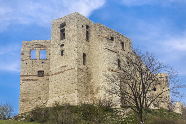The ruins of an old castle on a hill. Built of limestone. Kazimierz Dolny is a medieval city over the Vistula.