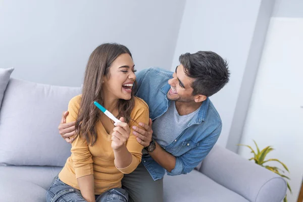 Gladness young couple after pregnancy test result
