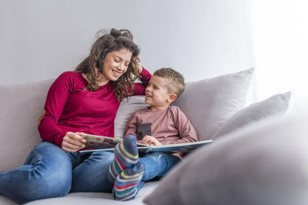 Young Woman Little Son Reading Book Sofa — Stock Photo, Image