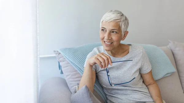 Mature Grey Haired Woman Sitting Sofa Posing Home — Stock Photo, Image
