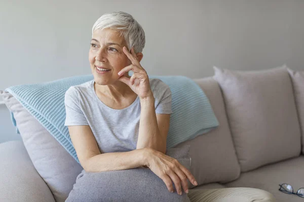 Happy Mature Woman Sitting Posing Couch — Stock Photo, Image