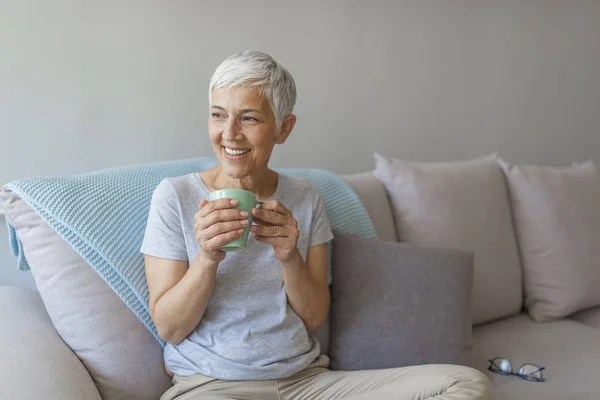 Portrait Old Mature Lady Sitting Couch Smiling She Enjoying Tasty — Stock Photo, Image