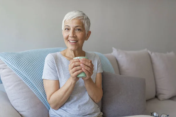 Happy Senior Woman Sitting Couch While She Drinking Cup Coffee — Stock Photo, Image
