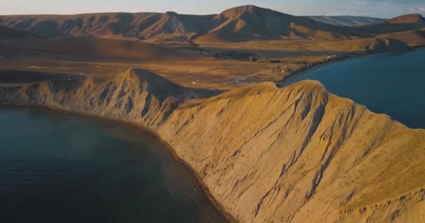 Mountains Peaks, Sunset and sea. Epic on the edge of the mountain valley with rocks and sun flare. 4k drone flight. Aerial establisher. Europe green nature. Film vintage colors. — Stock Video