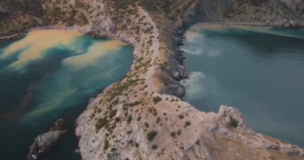 Mountains Peaks and sea. Epic on the edge of the mountain valley with rocks and sun flare. 4k drone flight. Aerial establisher. horizontal view. Europe green nature. Film vintage colors. — Stock Video