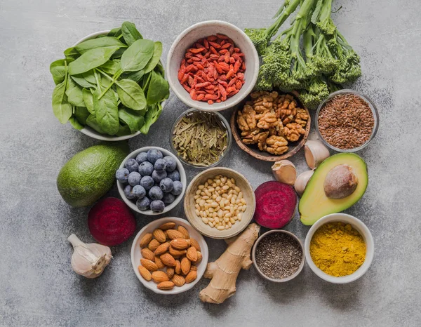 stock image Healthy clean food - vegetables, fruits, nuts, superfoods on a gray background. Healthy eating concept.