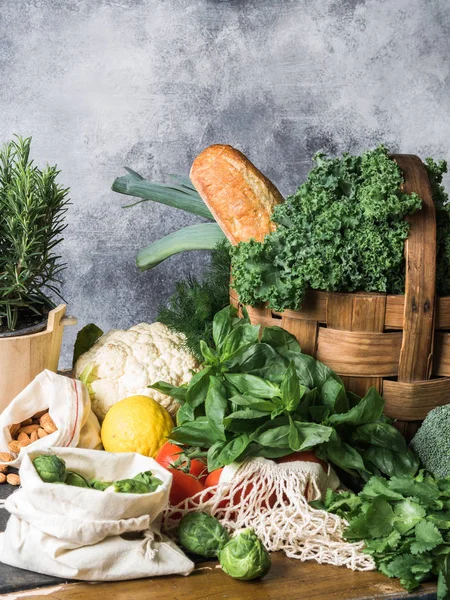 Healthy vegetarian ingredients for cooking. Various clean vegetables, herbs, nut and bread on table. Products from the market without plastic. Copy space — Stock Photo, Image