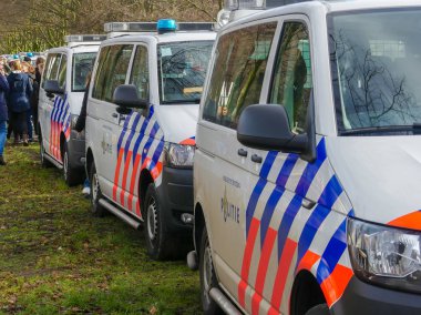 Malieveld, The Hague, the Netherlands - February 7 2019: police vans at climate change policy protest in The Hague closeup clipart