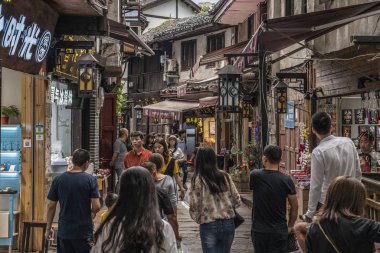 CHONGQING, CHINA - SEPTEMBER 20: Historic old town alley with shops and stalls in Ciqikou ancient town, a popular travel destination on September 20, 2018 in Chongqing