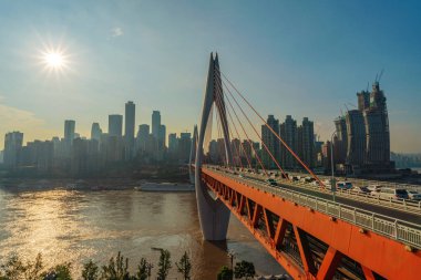 View of Dongshuimen Bridge and riverside city buildings in Chongqing clipart