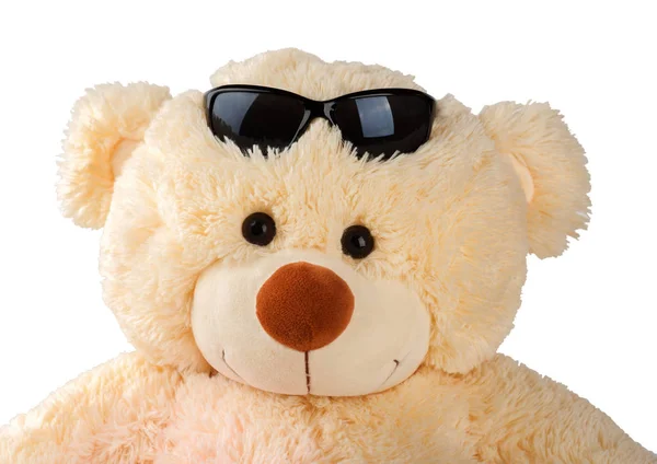 Smiling teddy bear with sunglasses isolated on white
