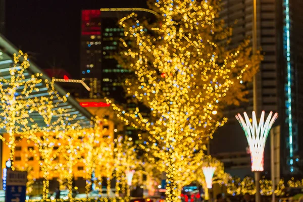 In the city, the festival lights are defocused