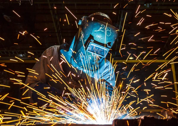 Industrial steel worker speeds motion in factory