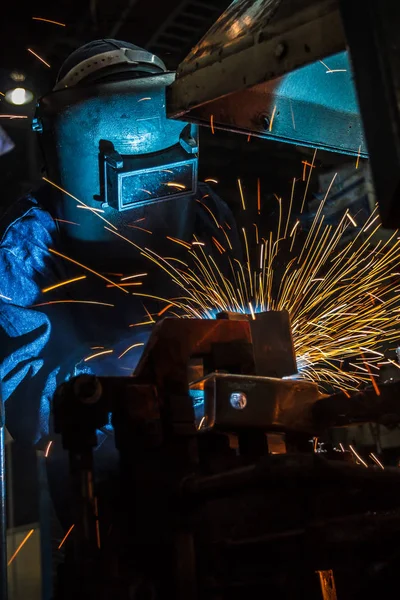 Industrial steel worker speeds motion in factory