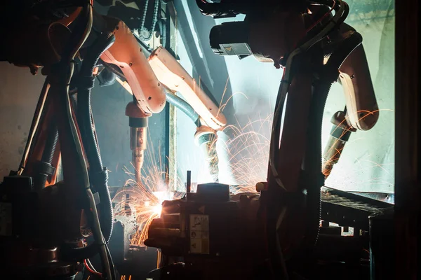 Welding robots movement in a car factory, automotive parts industry