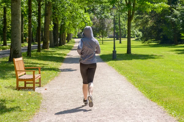 Rear View Middle Aged Woman Wearing Hoodie Running Park — Stock Photo, Image