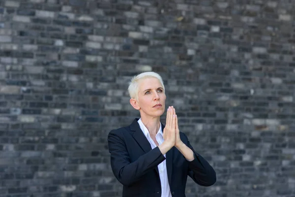 Praying Woman Folded Hands Looking Heaven Front Black Wall — Stock Photo, Image