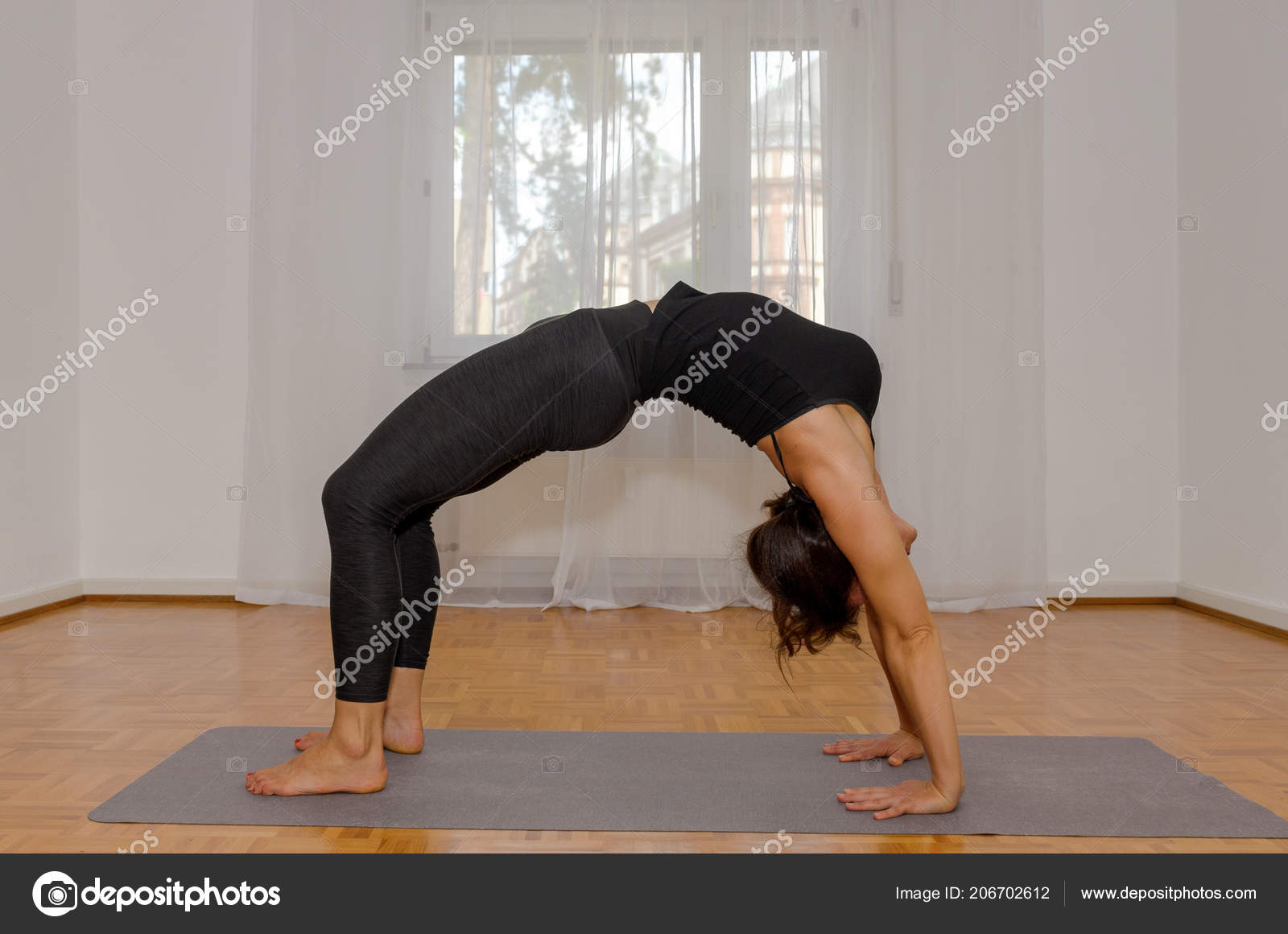 Sporty Woman Working Out Home Mat Wooden Floor Doing Yoga Stock